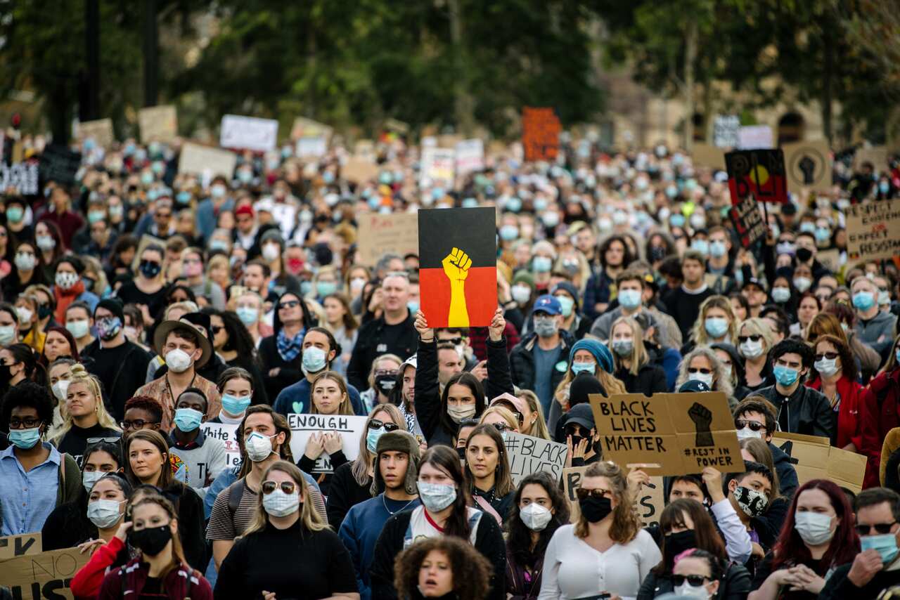 Protesters participate in a Black Lives Matter rally in Adelaide on Saturday, June, 6, 2020. A protest against the deaths of Aboriginal people in custody and solidarity with the US protests for George Floyd. (AAP Image/Morgan Sette) NO ARCHIVING