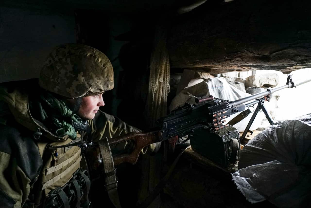 A Ukrainian soldier looks from his position near the frontline with Russia-backed separatists in Shyrokyne, eastern Ukraine