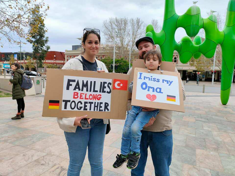 Families protest in Perth, calling for travel exemptions to include parents of Australian citizens.