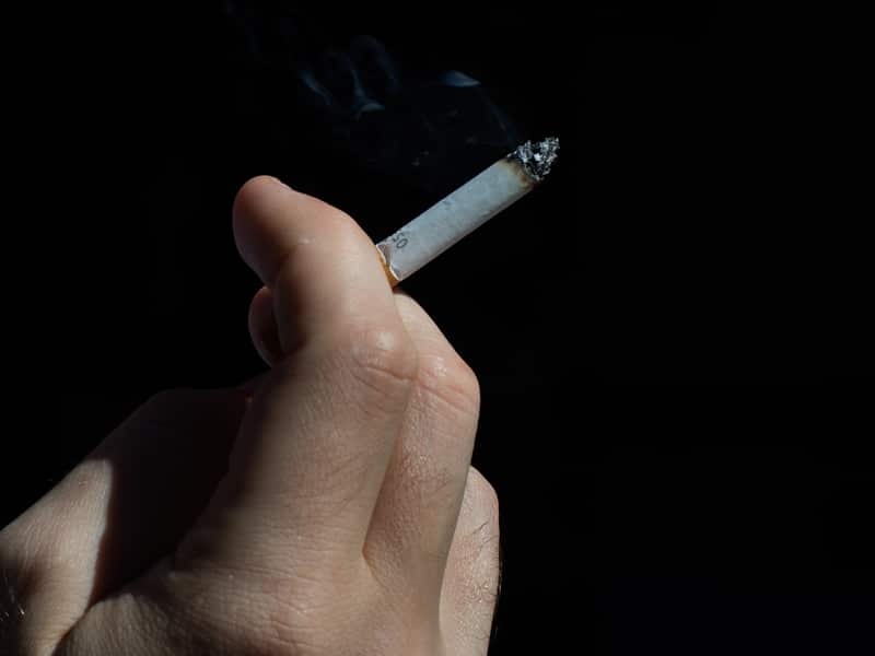 A smoker enjoys a cigarette