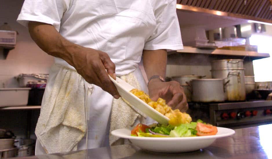 The two Indian workers, employed as cooks, were threatened with violence, the court found.