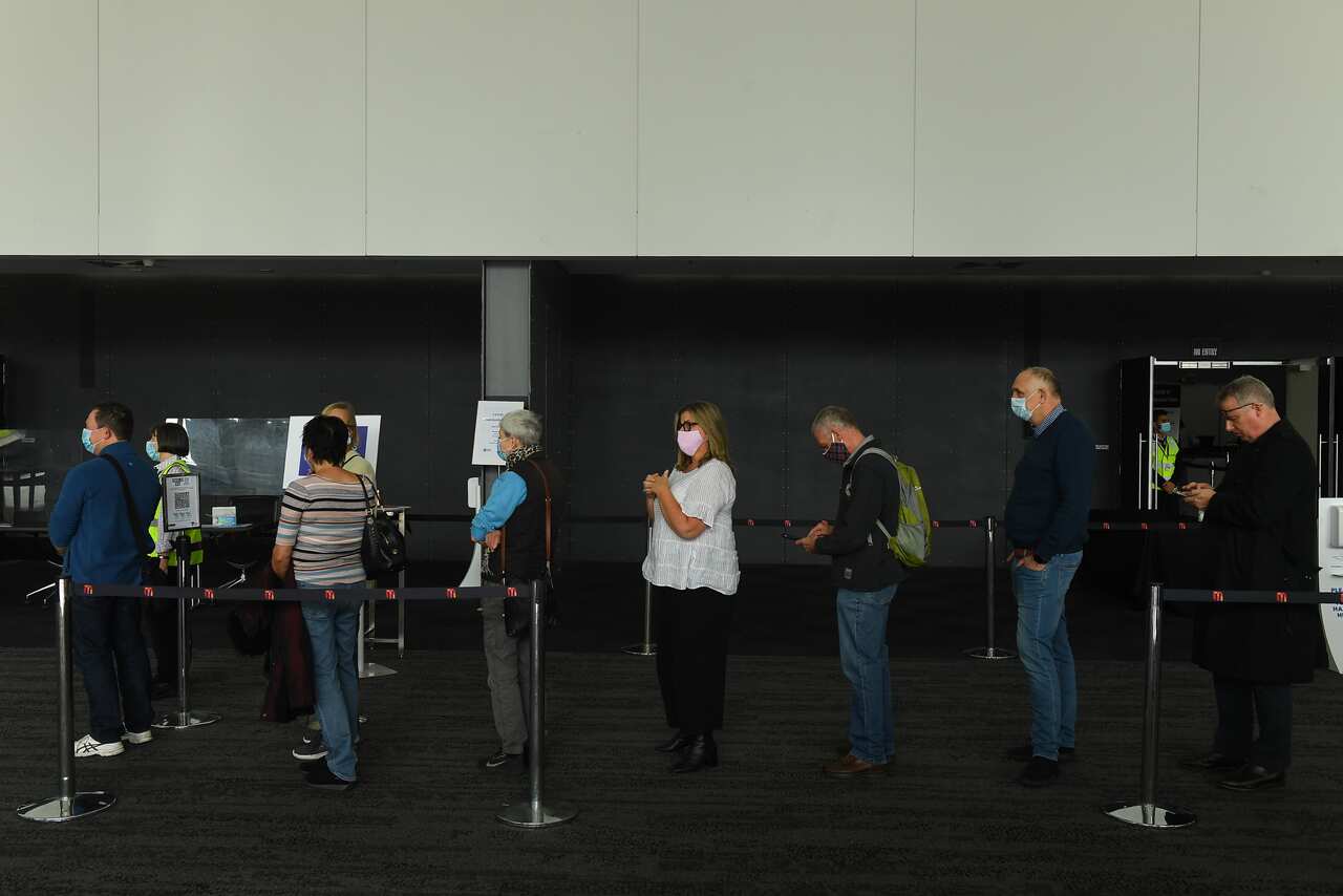 People wait in line for a vaccine in Melbourne on 3 May. 