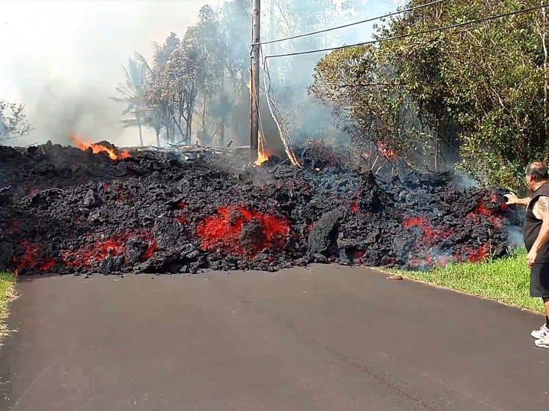 Lava flows down residential road in Hawaii