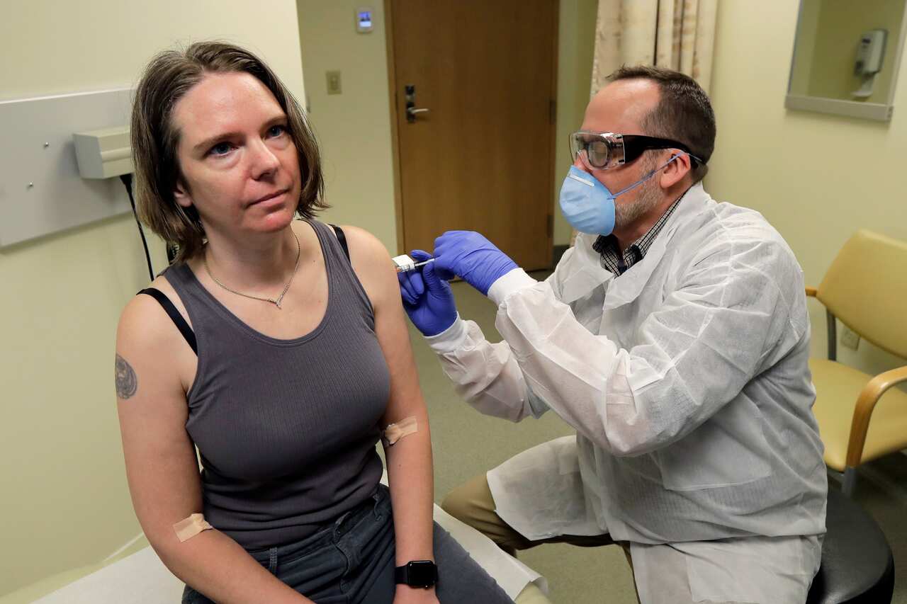 Jennifer Haller is given the first shot in the clinical trial of a potential vaccine for the COVID-19 coronavirus made by biotech firm Moderna in March, 2020.