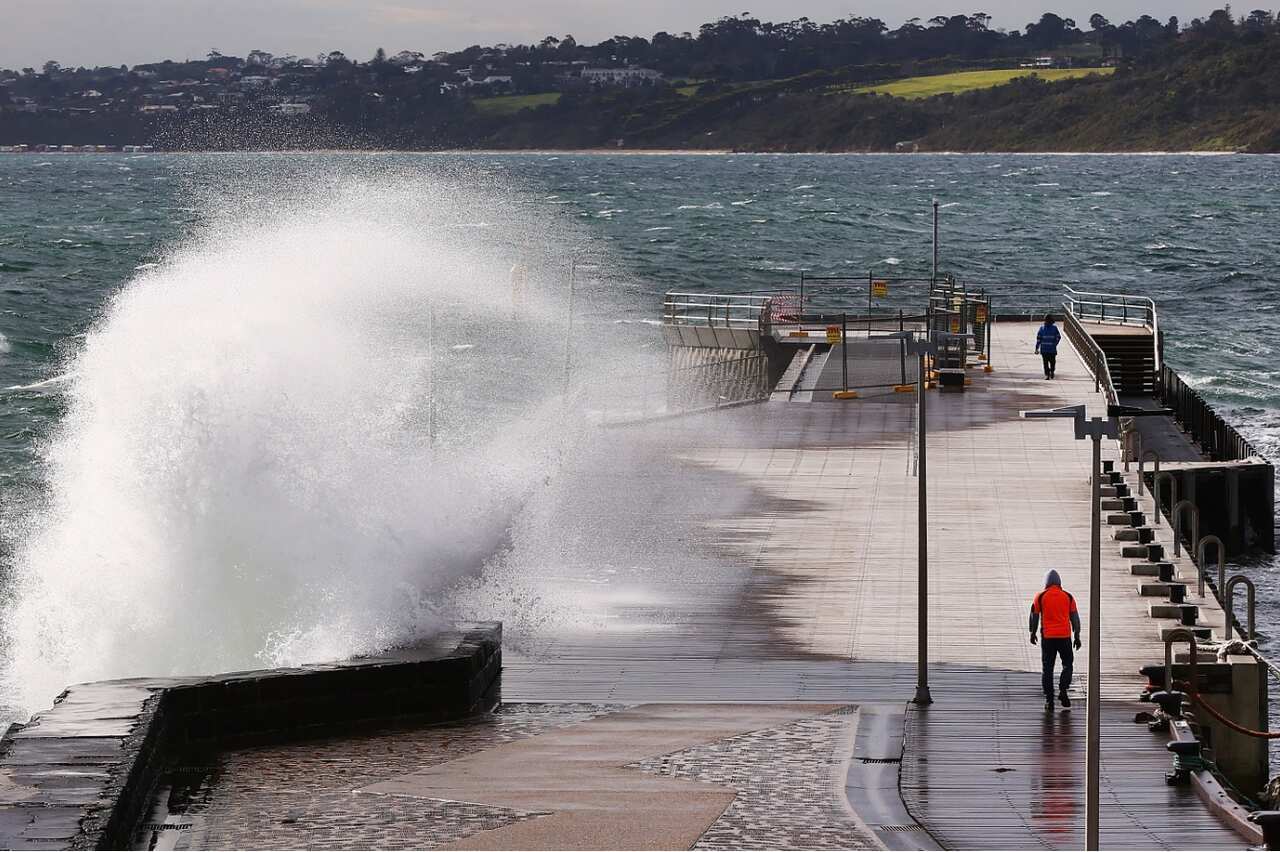 Large waves crash over Mornington Pier on July 23, 2018 in Melbourne, Australia. 