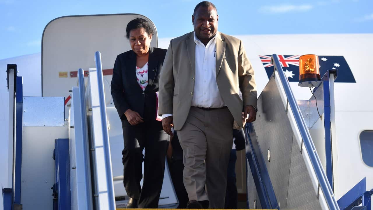 Papua New Guinea's Prime Minister James Marape and wife Rachel Marape arrive at Fairbairn Airbase in Canberra.