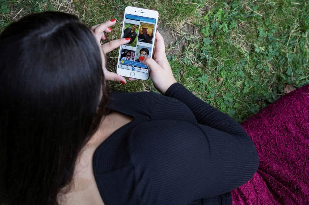 A woman using a dating app (Getty Images)