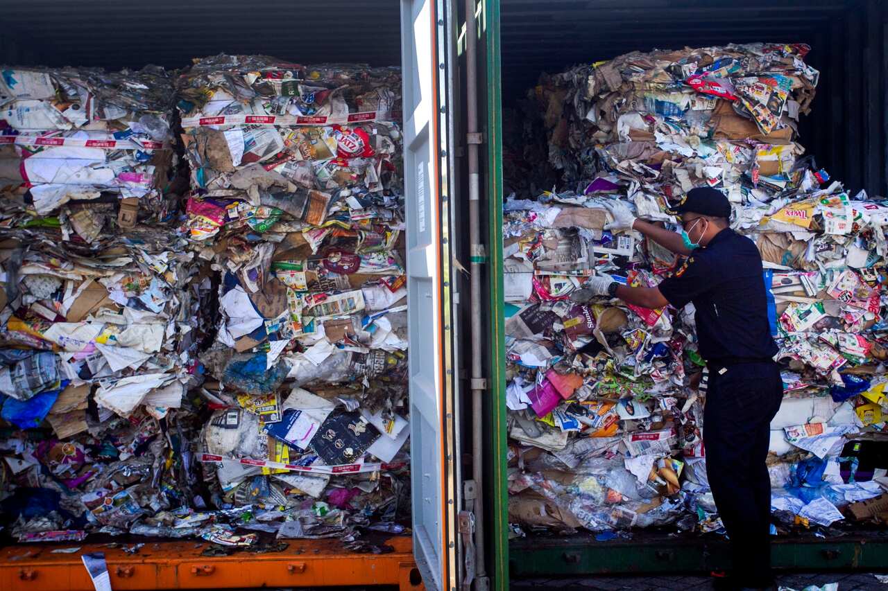 Containers loaded with a combination of garbage, plastic waste and hazardous materials from Australia at Tanjung Perak port in Surabaya.