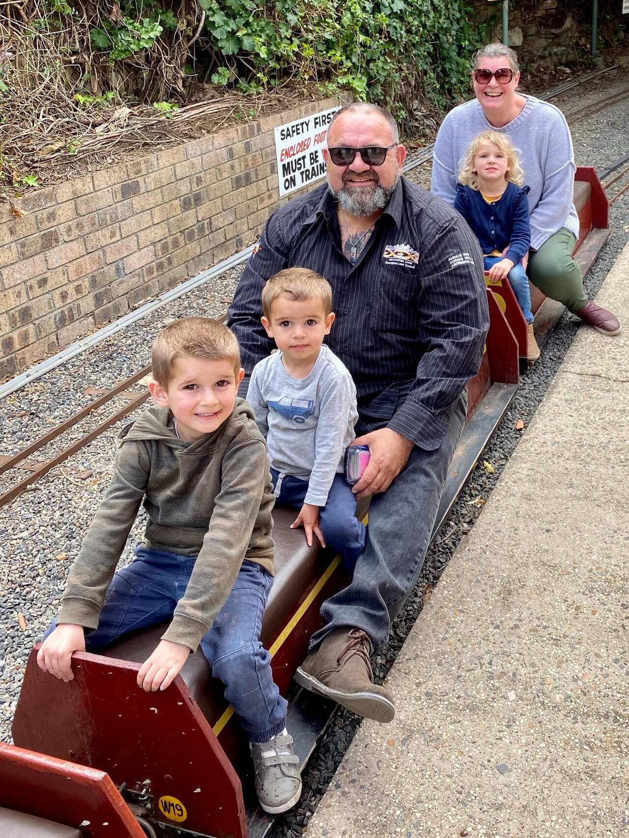 Brendan with three of his eight children, Tre Marrawarra (6) , Zamzi Mae (5), Cash Paaka (3).