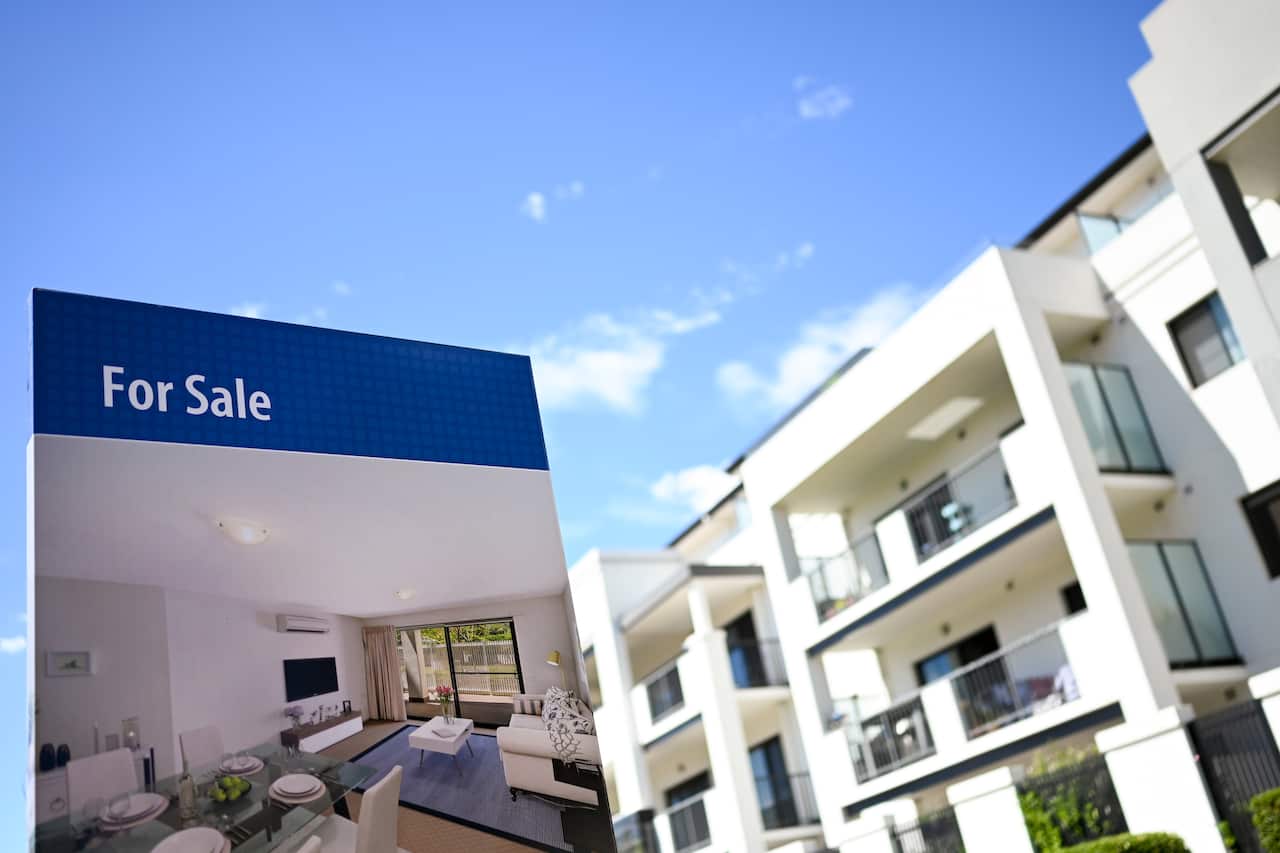 A real estate advertising board is seen next to a house in Canberra, Friday, March 1, 2019. (AAP Image/Lukas Coch) NO ARCHIVING