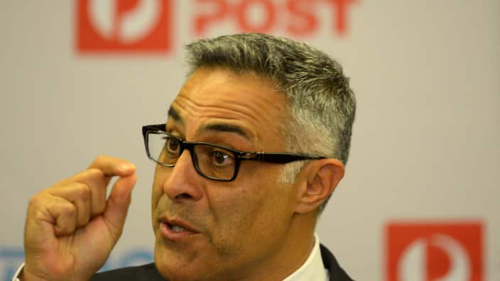 Australia Post CEO Ahmed Fahour during a press conference in Melbourne, Tuesday, Mar. 3, 2015. Australia Post plans to raise the basic stamp price from 70c to $1. (AAP Image/Tracey Nearmy) NO ARCHIVING