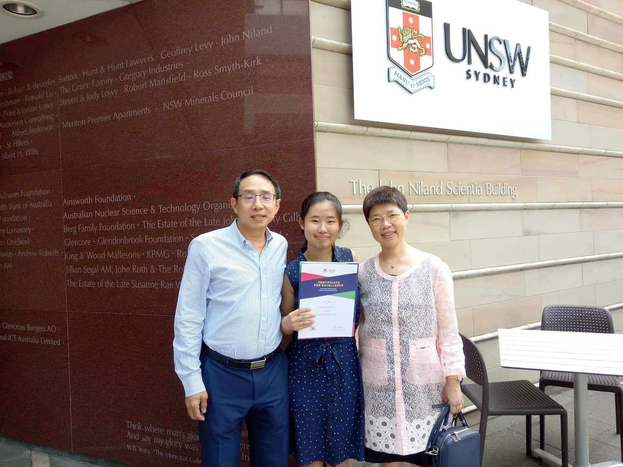 Family photo taken at the NESA First in Course Ceremony