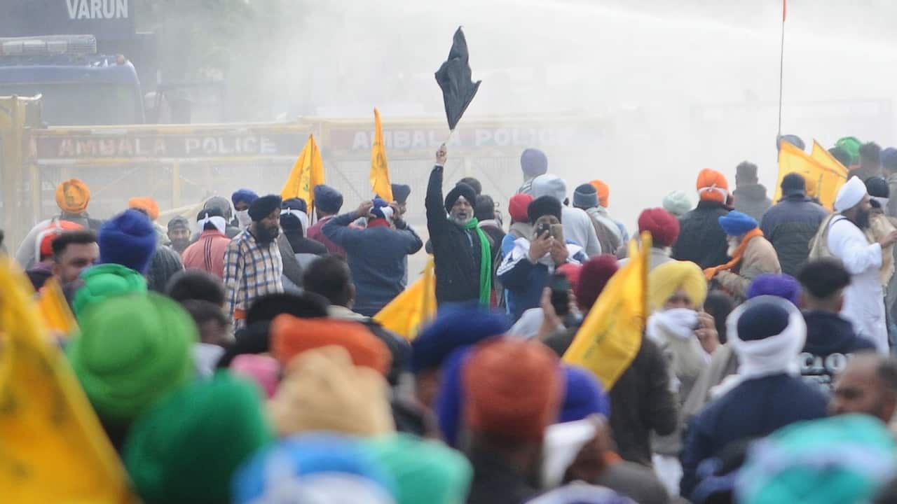 Water cannon is used against farmers by Haryana state police to stop them from entering Haryana as they march towards New Delhi to protest against new farm laws, 