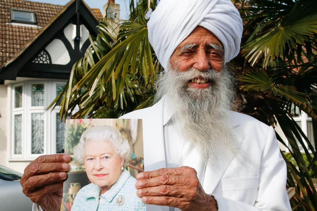 Fauja Singh with a personalised greeting from Queen Elizabeth on his 100th birthday
