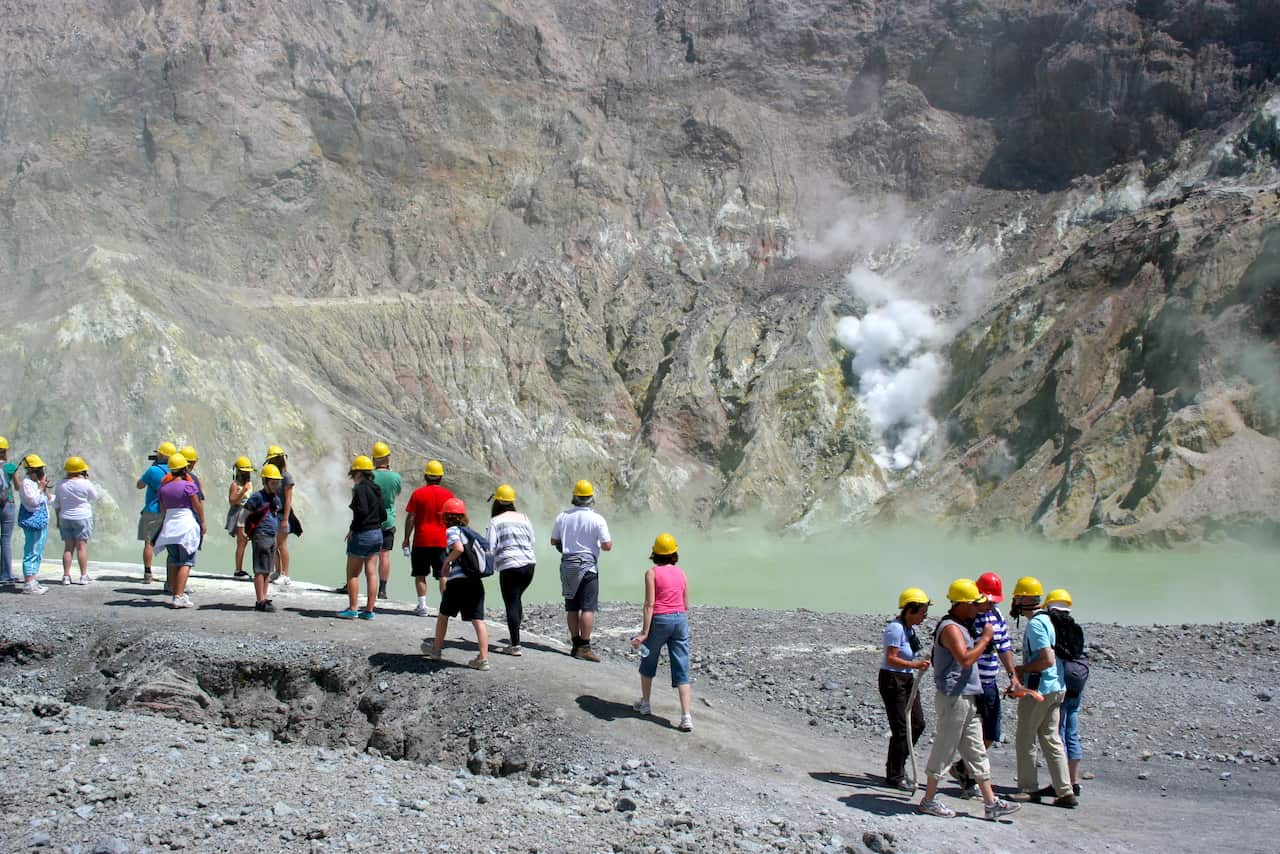 Visitors on White Island, New Zealand before it erupted.