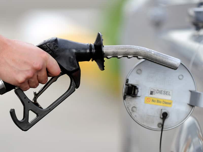 A man pumps petrol at a service station in Melbourne