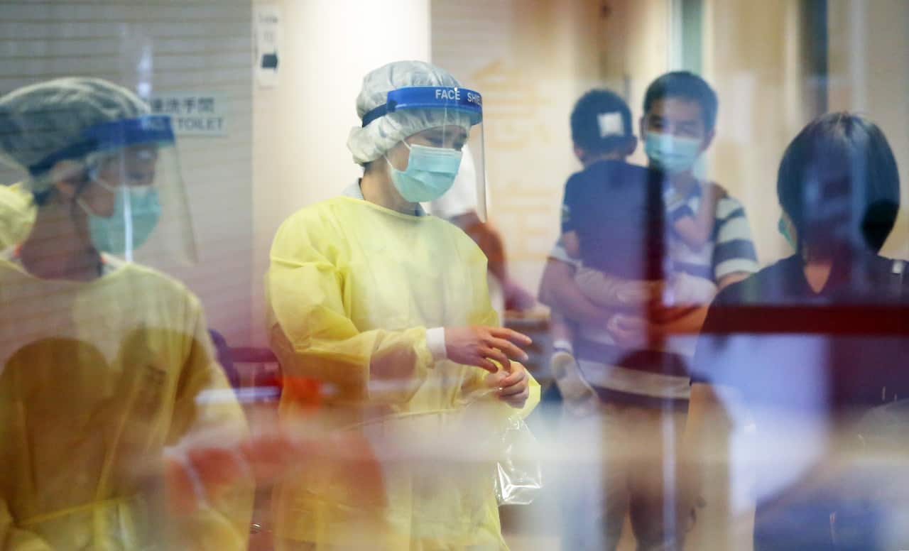 Medical staff at the Kwong Wah Hospital in Yau Ma Tei are seen in protective outfits.