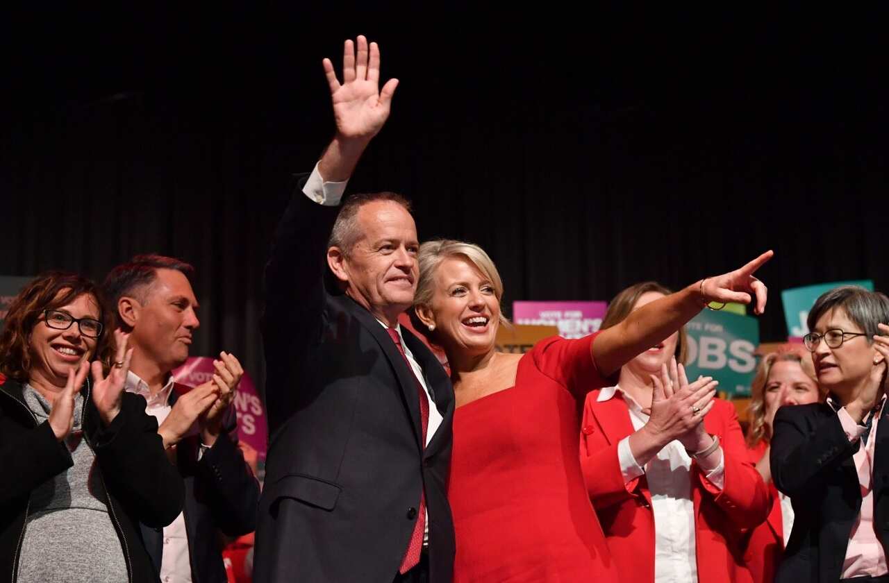 Australian Opposition Leader Bill Shorten (left) and his wife Chloe Shorten (right) are seen during a Labor Party campaign rally