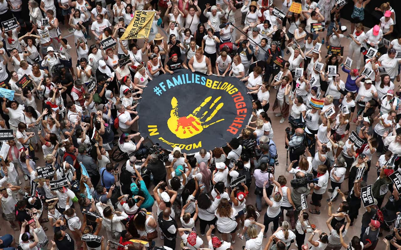 Protesters that marched from Freedom Plaza to the US Capitol demonstrate inside the Hart Senate Office Building against family detentions.