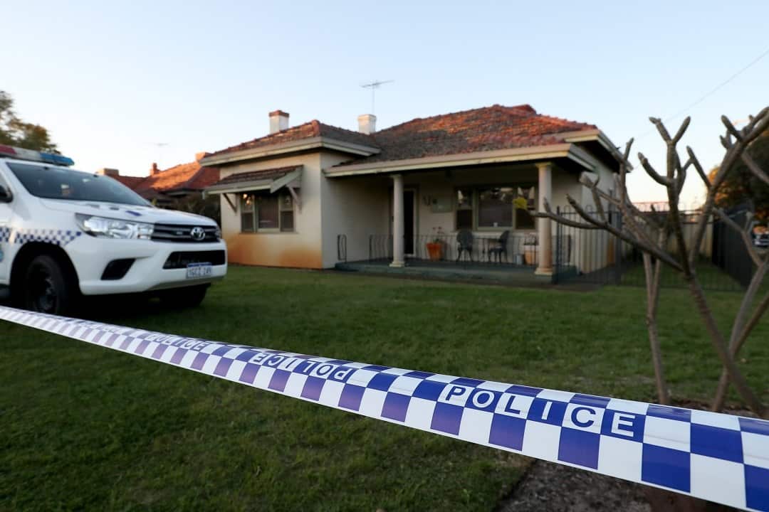 Police are seen outside a property in Bedford, Perth where five bodies were discovered.