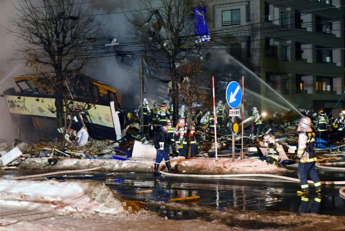 Firefighters work on site where a large explosion occurred at a restaurant in Sapporo, Japan