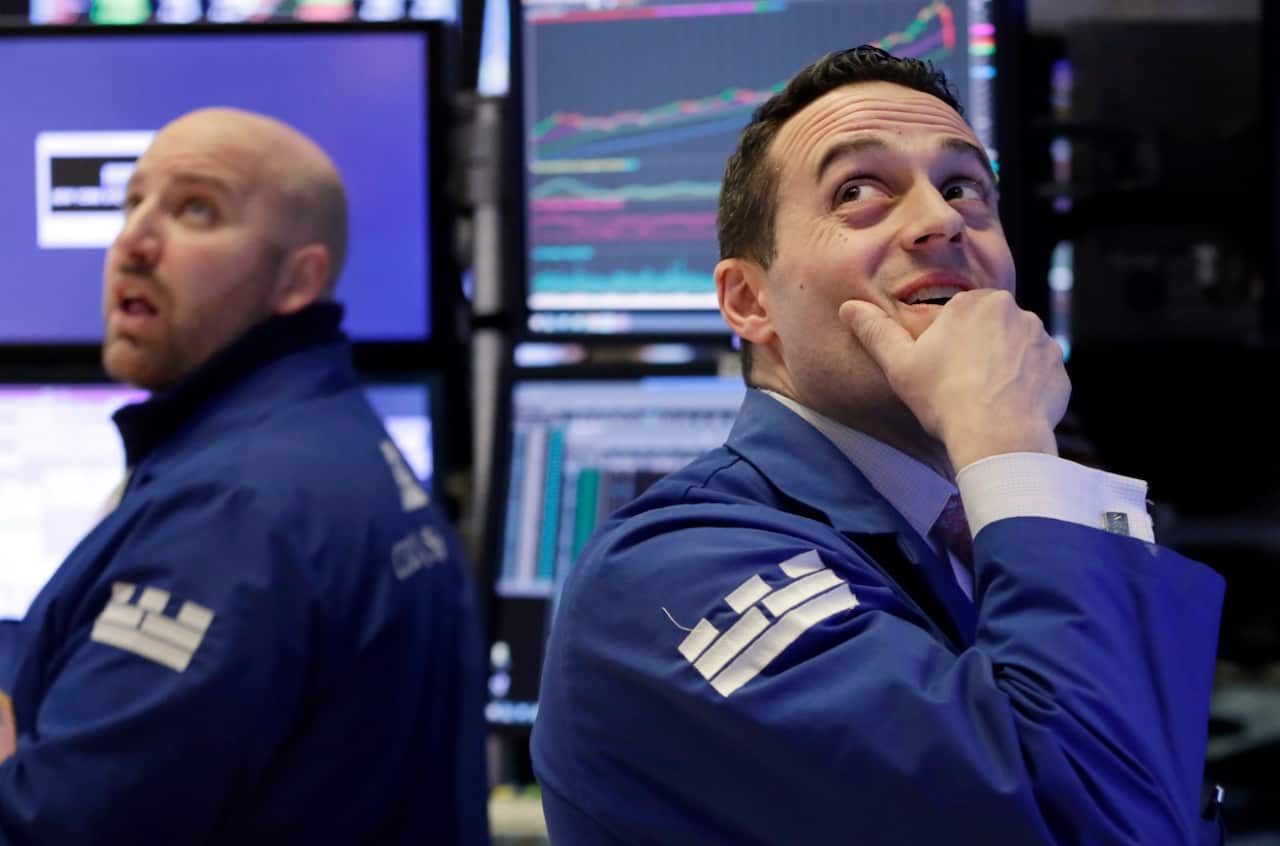 Specialists John Parisi, left, and Michael Gagliano work on the floor of the New York Stock Exchange, Monday, Feb. 5, 2018. 