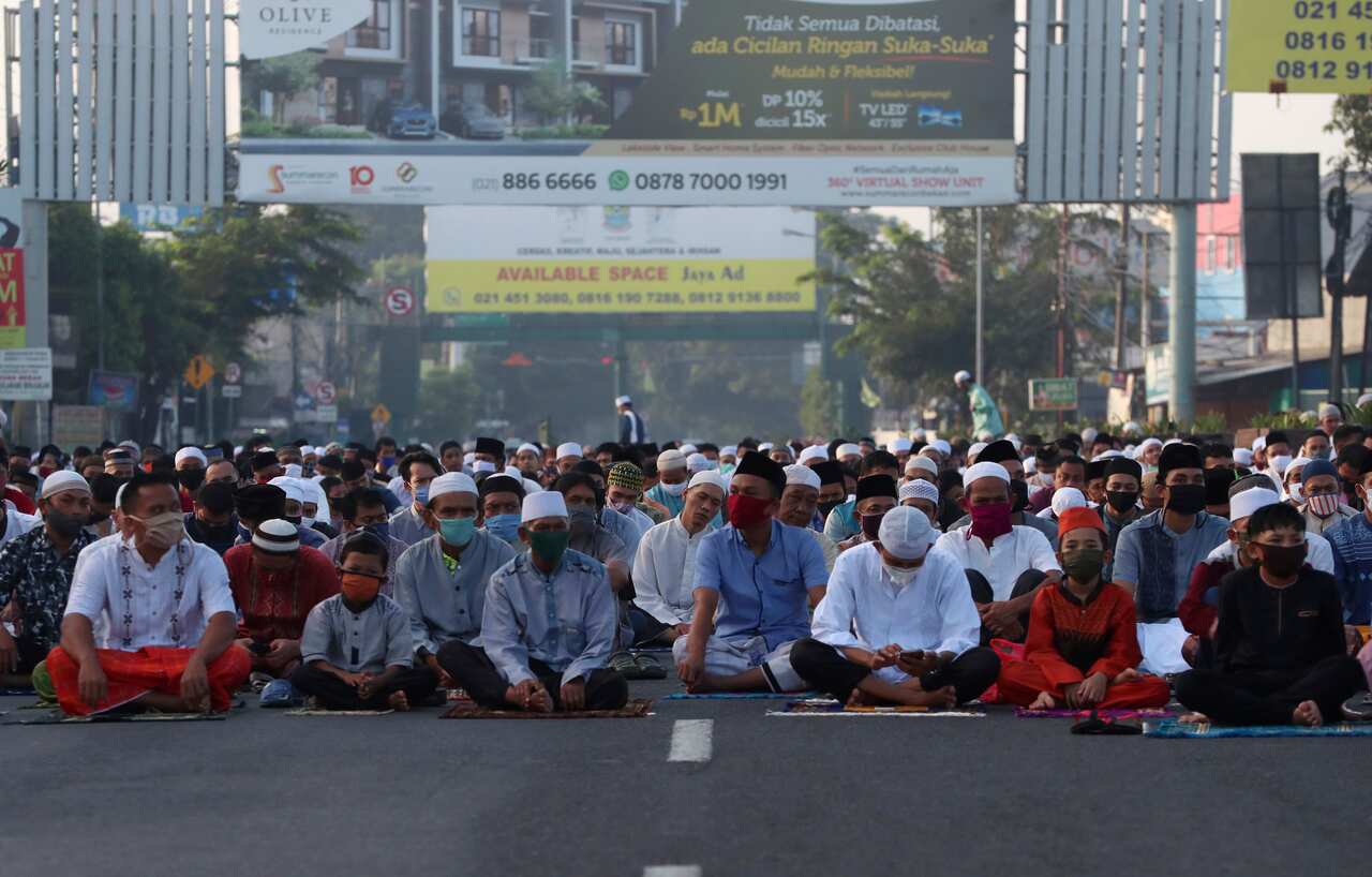 Indonesian Muslim attend Eid al-Fitr prayer that marks the end of the holy fasting month of Ramadan in Bekasi on the outskirts of Jakarta