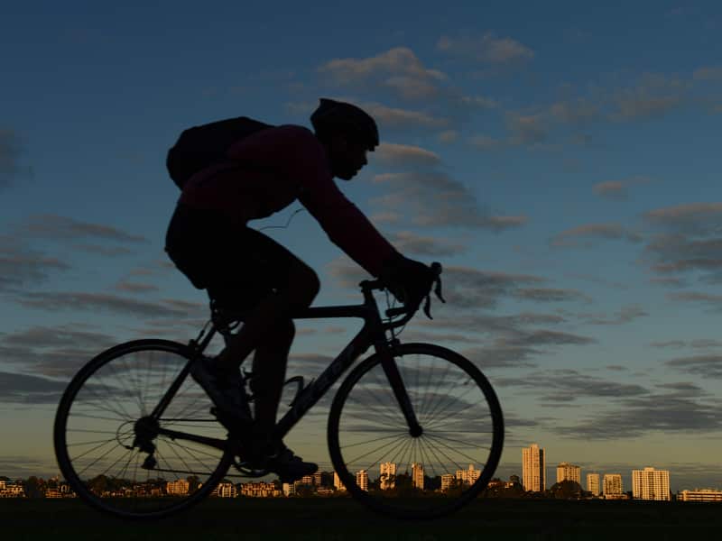 A cyclist rides through Perth.