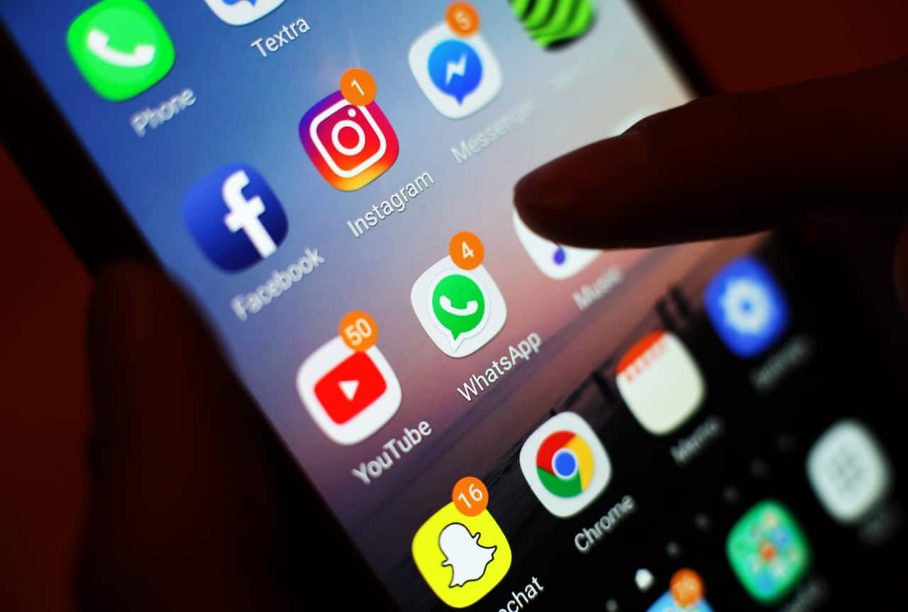 Social media apps displayed on a mobile phone, 2019.
