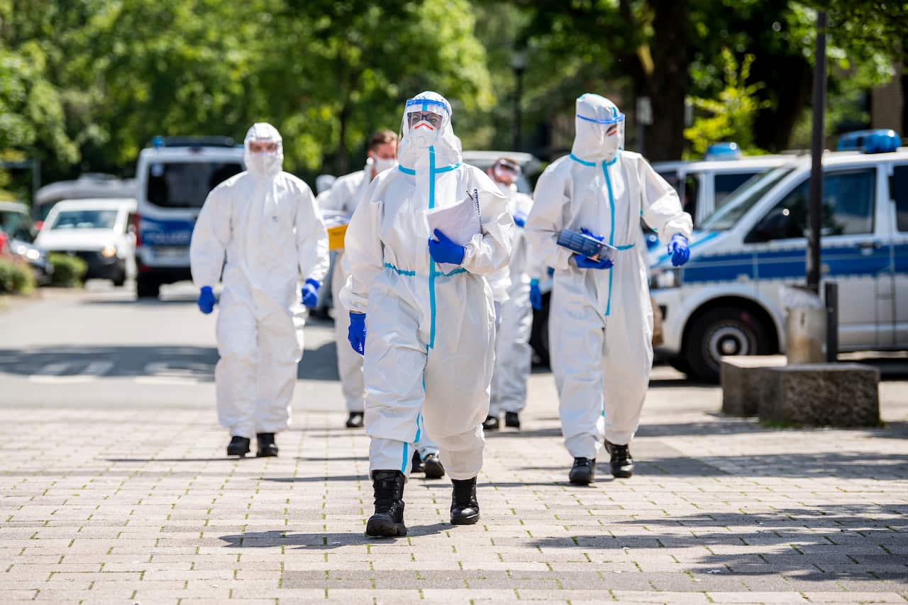 German army soldiers in protective suits arriveto test more people for the coronavirusin the city of Verl.