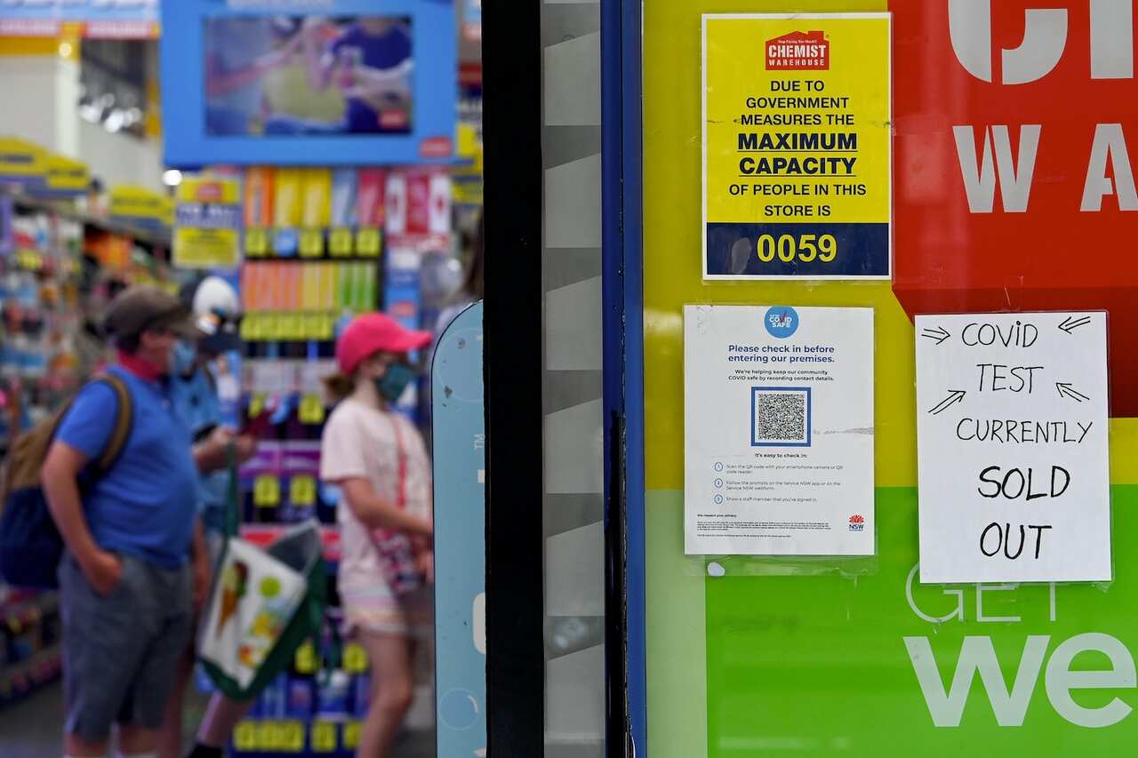 Signage notifying customers that Rapid Antigen Test (RAT) kits are sold out is seen on the entrance to a chemist in Sydney, Tuesday, 11 vJanuary, 2022. 
