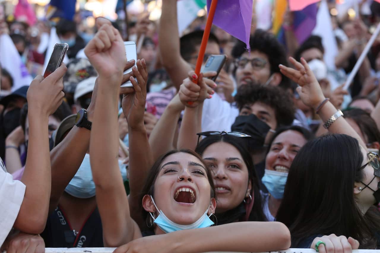 People celebrate the victory of presidential candidate Gabriel Boric, in Santiago, Chile 19 December 2021.