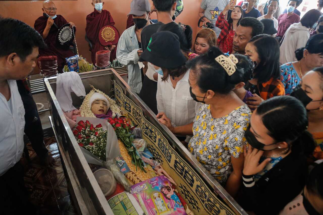 Aye Myat Thu’s funeral, where her family placed some of her favorite possessions alongside her. She was killed on 27 March, 2021.