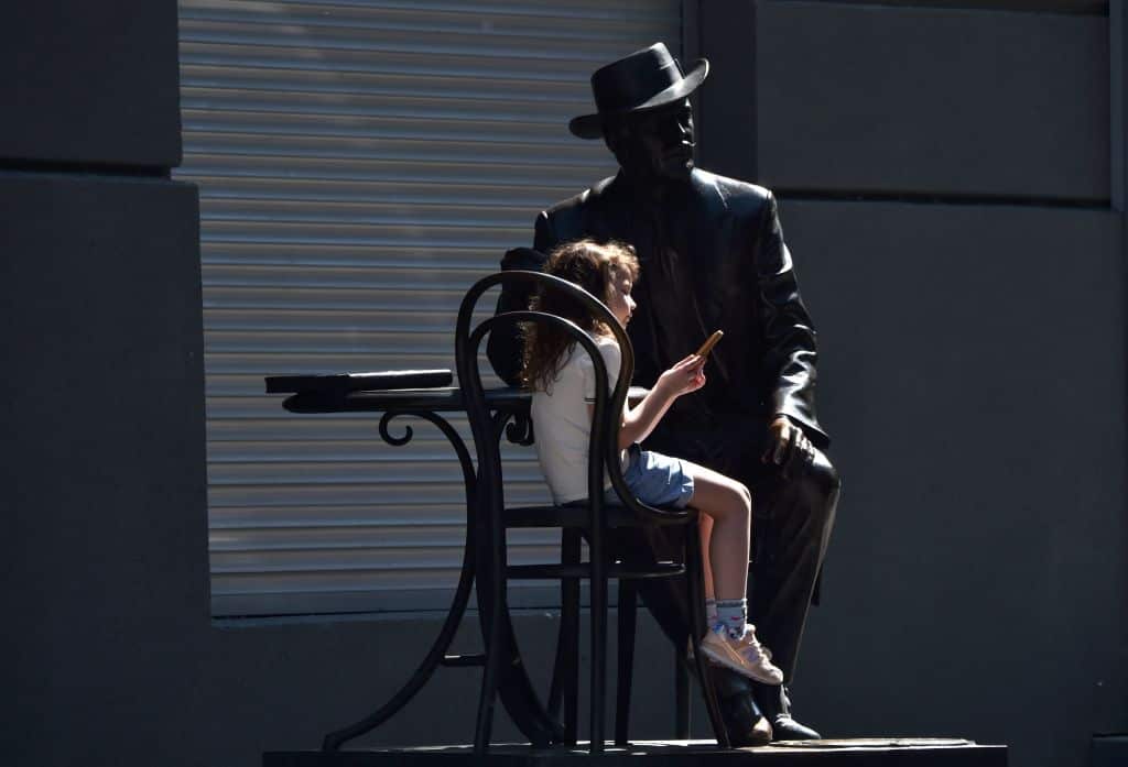 A girl plays with a smartphone