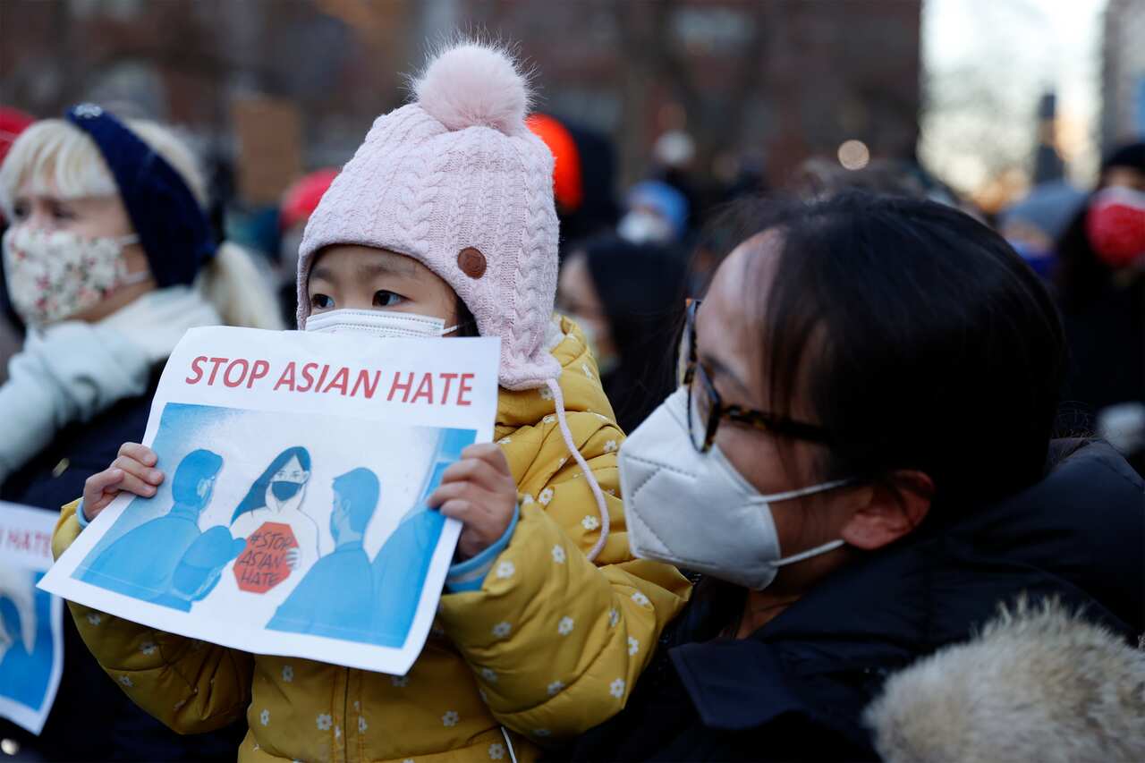 A child holds up sign during a Vigil for Peace, organised by the Asian American Federation, in Union Square in New York City, New York, USA, 19 March 2021.