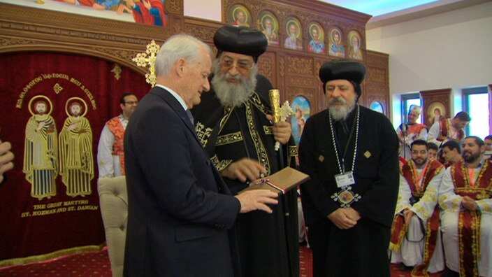 Former immigration minister Phillip Ruddock and Pope Tawadros II. 