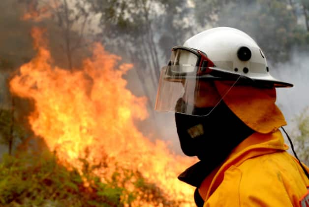 Firefighters carry out a hazard reduction burn along Putty Rd in Colo Heights near Sydney. AAP