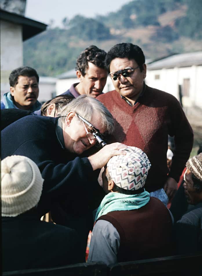 In January 1992, Dr Hollows and Dr Ruit examine patients in an eye clinic in rural Nepal. 