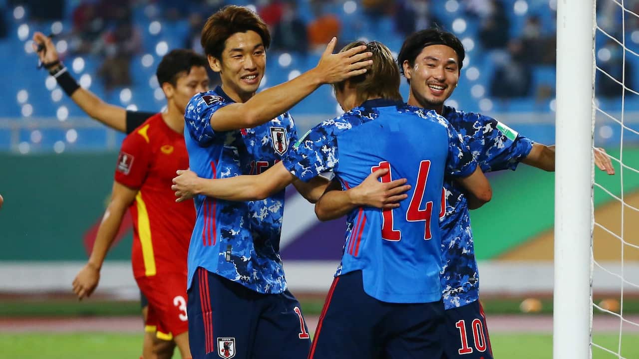 Junya Ito of Japan (C) celebrates after scoring during the the final round of the 2022 FIFA World Cup Asian Qualifiers match between Vietnam and Japan, at My Dinh stadium in Hanoi, Vietnam 11 November 2021.