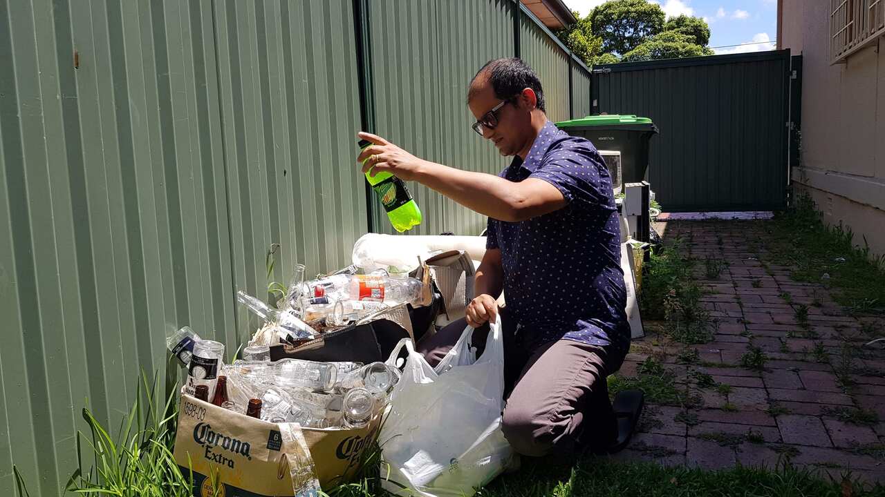 Nepali community leader Rishi Acharya is collecting recyclables to help build a school in Nepal