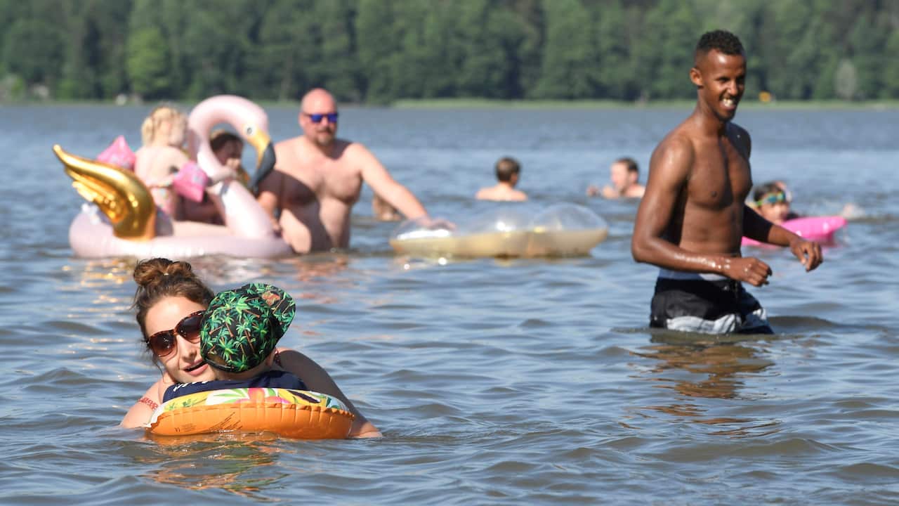 People enjoy hot summer day in a lake in Espoo, Finland.