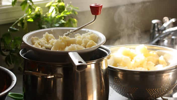 Using a mouli to mash your potatoes will release minimal starch.
