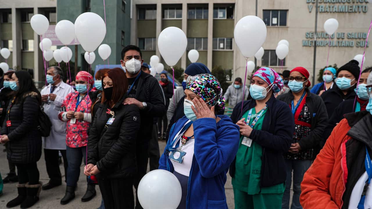 Health workers take part in a processional tribute for their colleague Patricia Duran, 42, who died due to COVID-19 complications according to her husband Dagoberto Marquez, in Santiago, Chile, Tuesday, July 7, 2020.