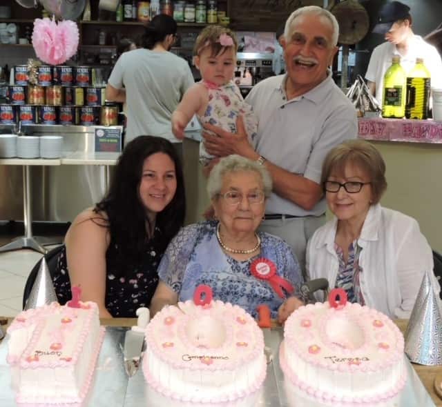 Franco Papandrea celebrating his mum's 100th birthday with his wife, his daughter and his baby granddaughter.