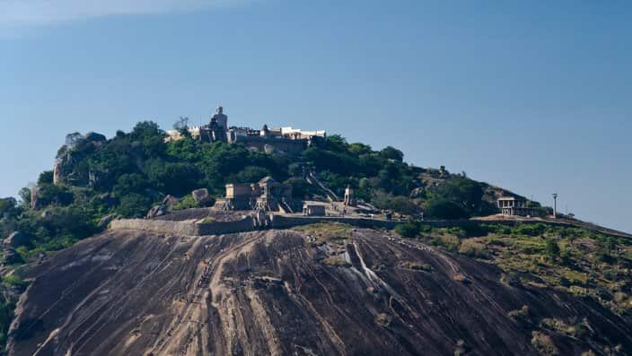 On top of the hill stands the 18 meters high and 983 AD created statue of Gomateshwara.. 