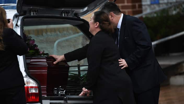 Mourners are seen outside of the St Dimitros Greek Orthodox Church in Moonee Ponds, Melbourne, Monday, June 3, 2019. The Funeral service for Melbourne murder victim Courtney Herron has taken place today. (AAP Image/James Ross) NO ARCHIVING