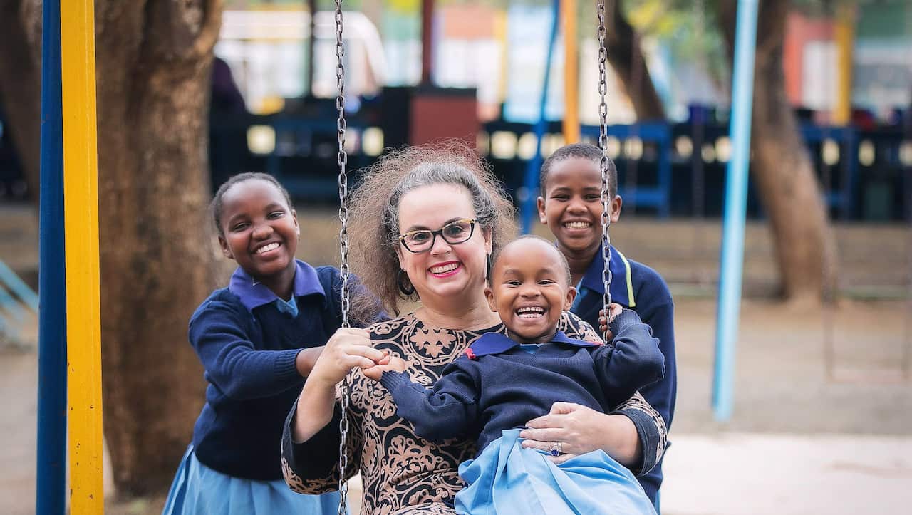Gemma Sisia with three students
