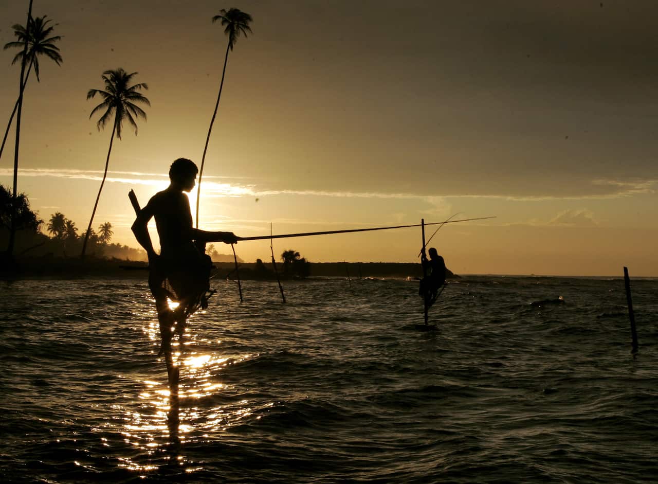 fishermen fish at sunrise in the bay nea