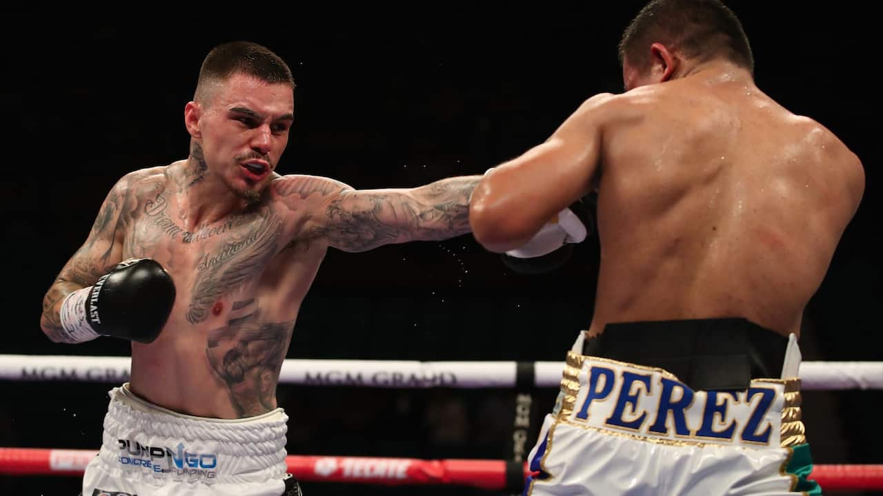 George Kambosos Jr (L) throws a left on Ray Perez