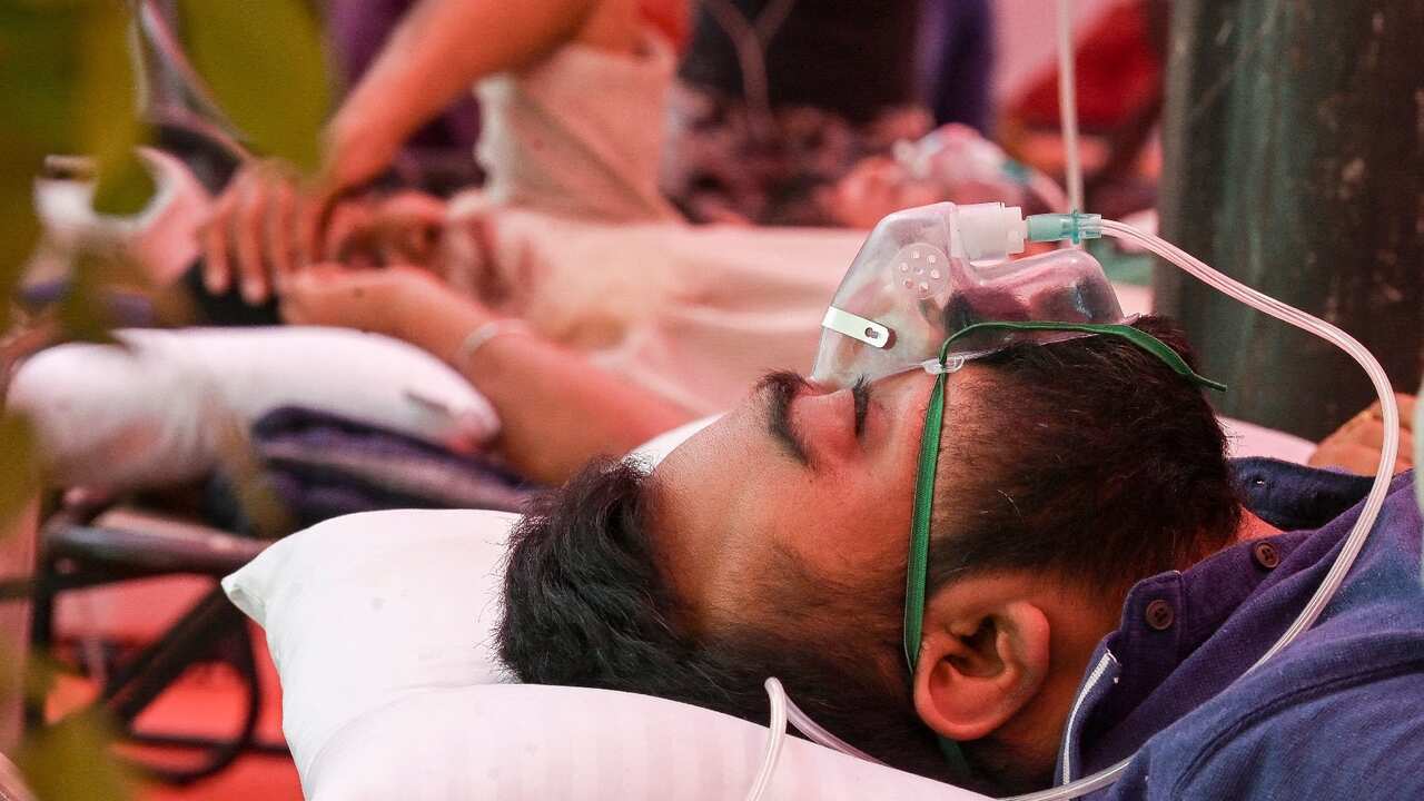 A Covid-19 coronavirus patient breathes with the help of oxygen provided by a Gurdwara, a place of worship for Sikhs.